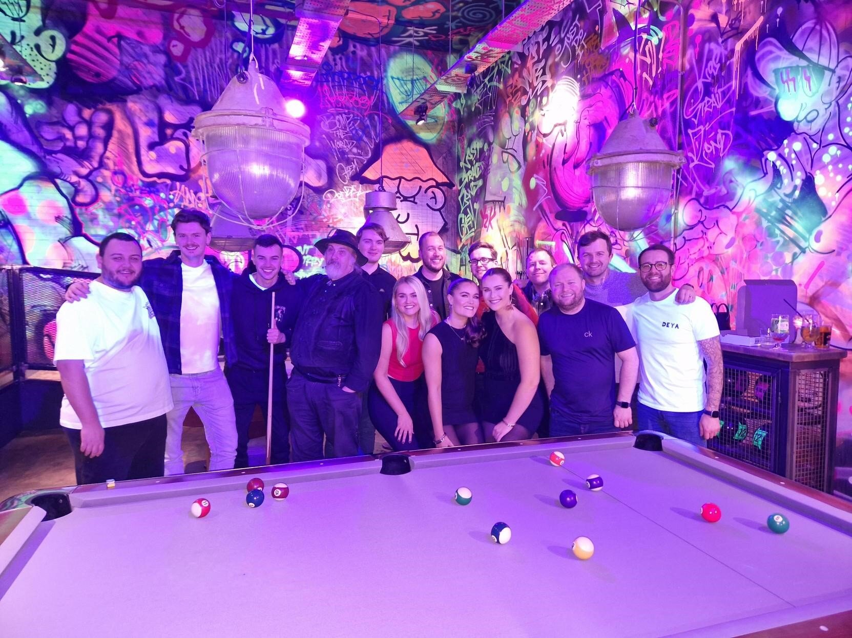 Team playing pool in Liverpool