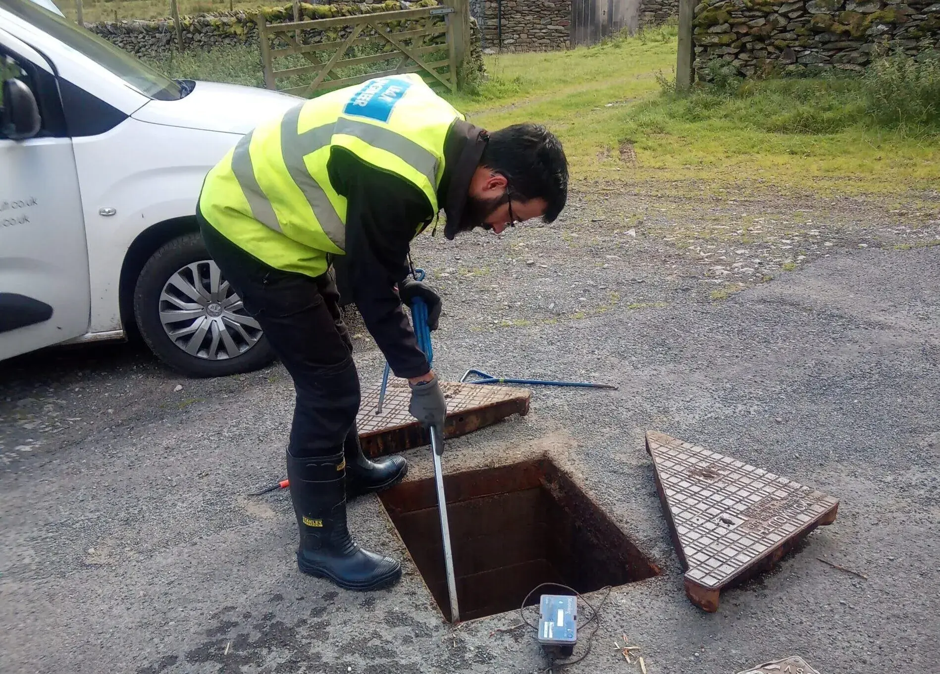 Water Engineer carrying out leakage detection in chamber